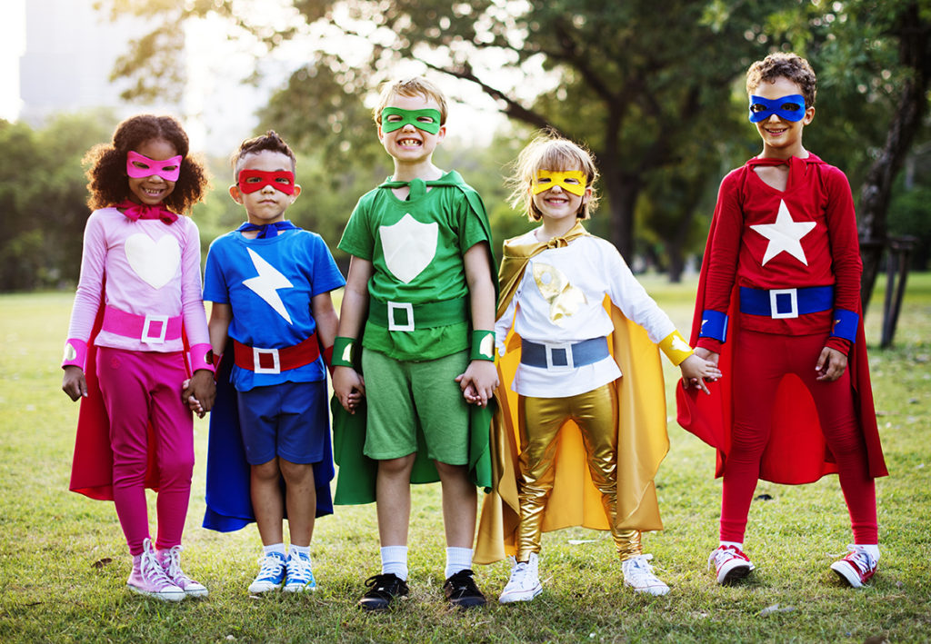 Kids in superhero costumes. With positive affirmations for kids, it's possible to be a "superhero" in everyday life.