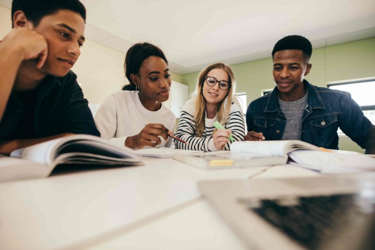 group of people studying for exam