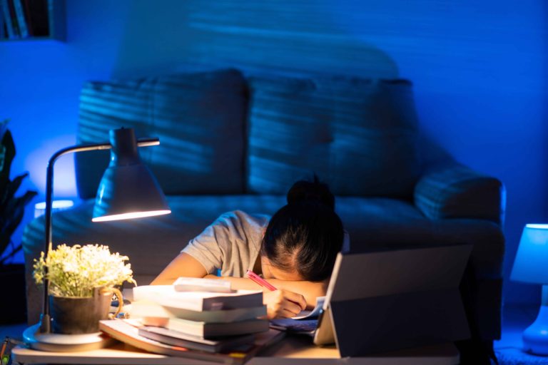 woman feeling like she is not doing enough at her work desk